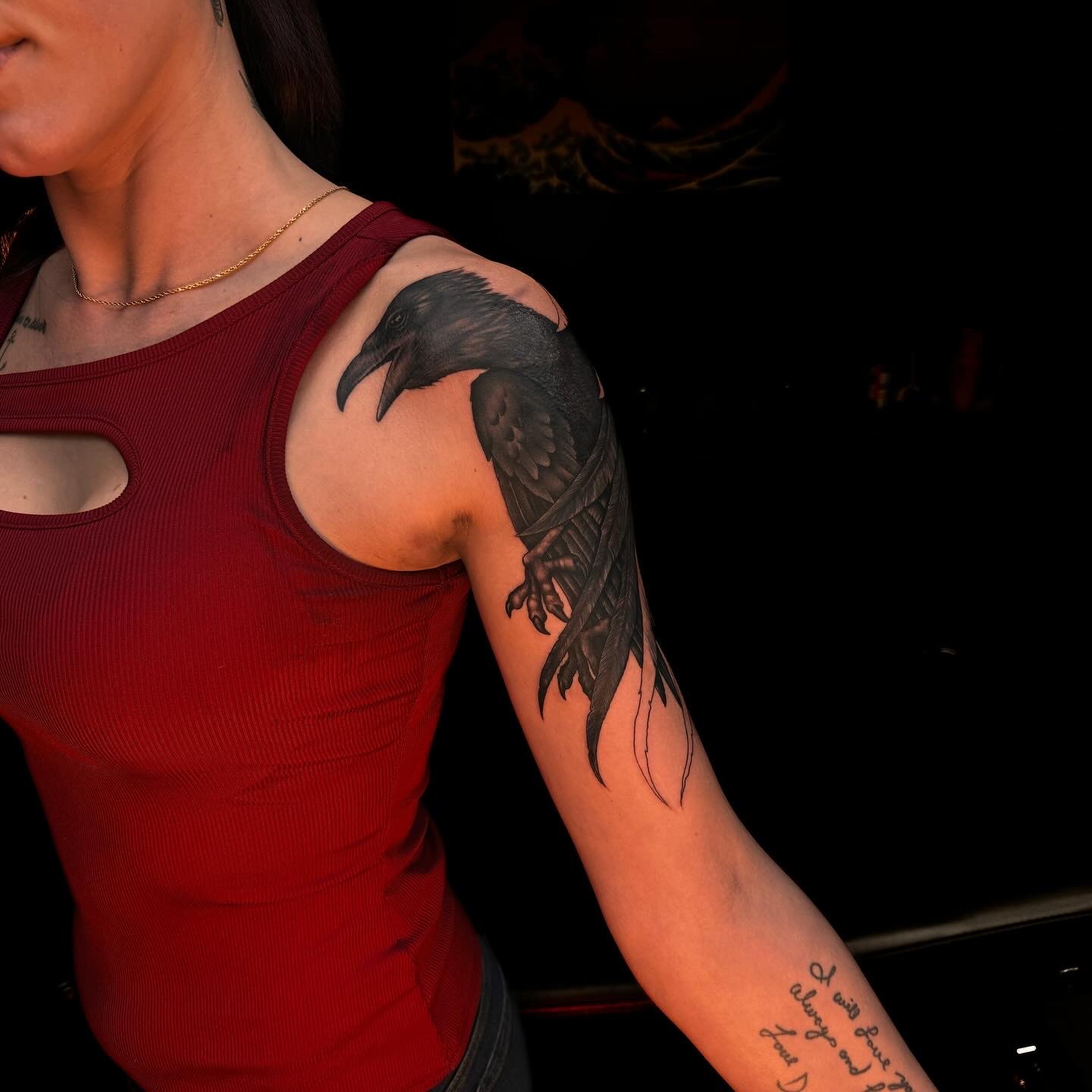 Black and gray raven tattoo
