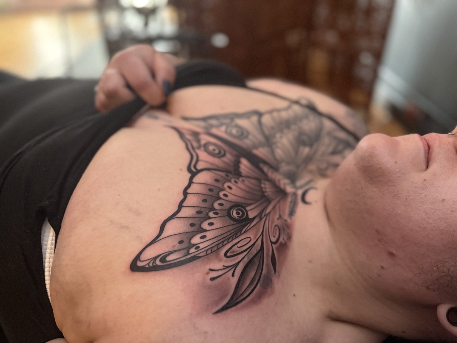 Butterfly tattoo on chest