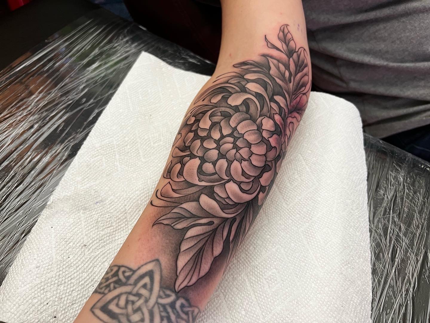 Floral forearm tattoo