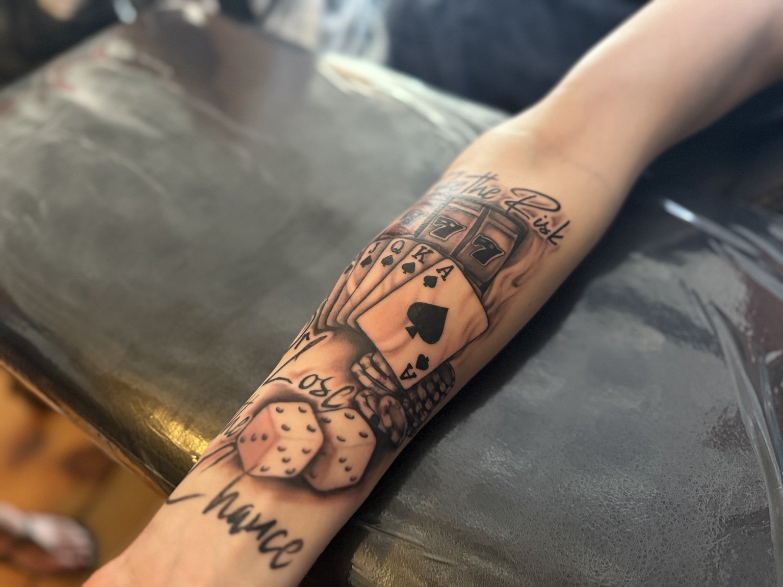 In-progress gambling themed tattoo