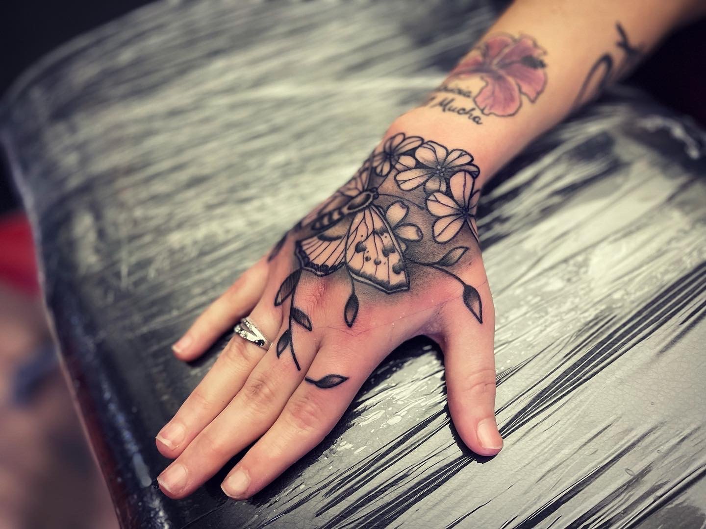 Moth tattoo on hand