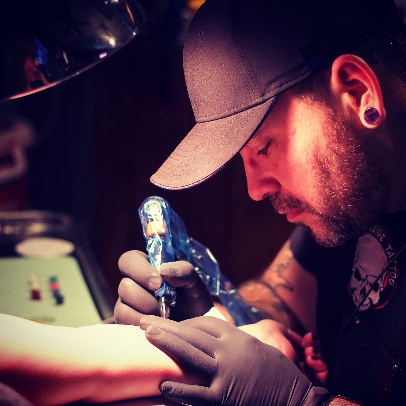 Alex tattooing in the studio